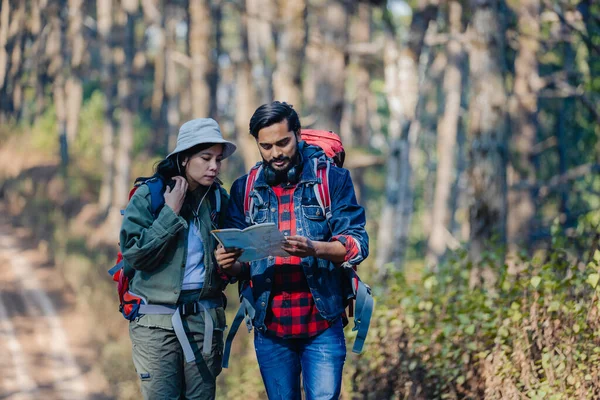 stock image Happy Travelers Hiking with Backpacks on the Beautiful Rocky Trail at Warm Sunny. Hikers with backpacks walks in mountains. travel in the mountains with backpacks. Travel in the mountain with backpack