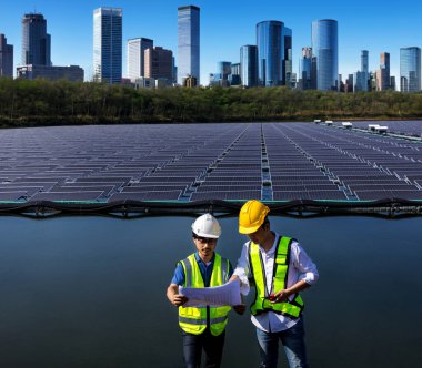 Engineer working setup Floating solar panels or solar cell Platform system on the lake. Engineer or worker work on site Floating solar panels or solar cell Platform system on the lake.	
