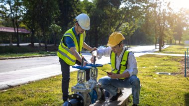 Industrial engineer work on site. engineer visit and inspection site engineer at industrial site. Inspector engineer check and working on site