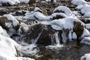 Forest and mountain in Winter Season. The snow-covered fields. Awesome Beautiful tourism winter vacation background