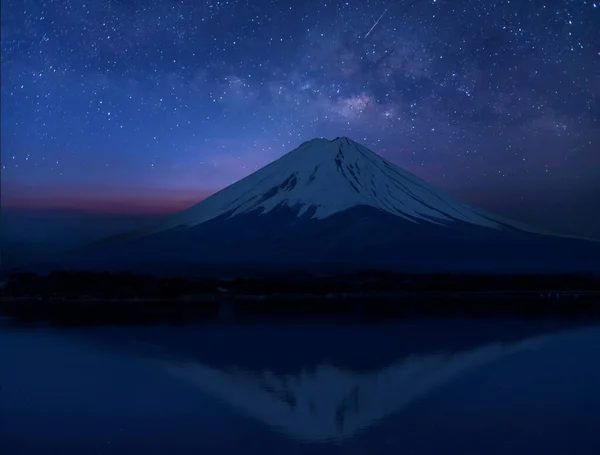 stock image Japan icon Mt Fuji at night and  universe space and milky way galaxy with stars on night sky background.