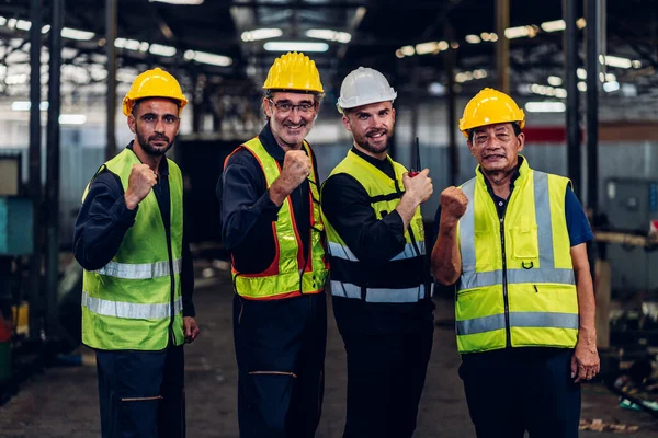 stock image Team Workers Factory or Team Engineering work at factory site check up machine or products in site. Foreman or Technician checking Material or Machine on Plant. Heavy industry factory concept.