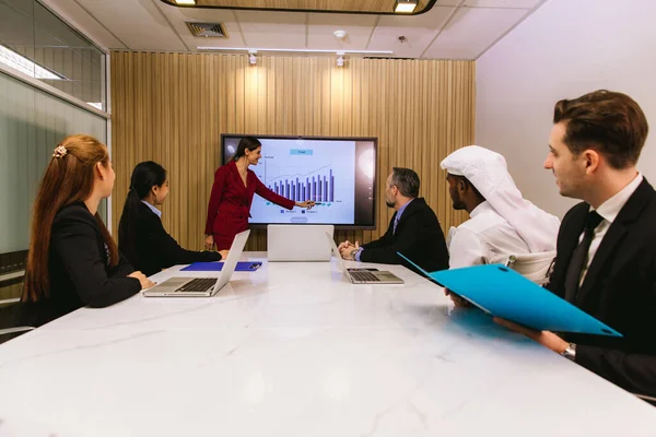 stock image Diverse colleagues gather in brainstorm discuss statistics together. Business People Meeting Conference Discussion Corporate Concept. Team Brainstorm Working Concept. people meeting 