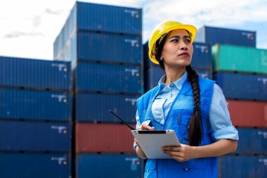 Foreman or worker work at Container cargo site check up goods in container. Foreman or worker checking on shipping containers. Logistics and shipping.	