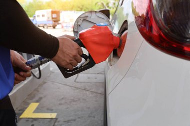 Man Refill and filling Oil Gas Fuel at station. Gas station - refueling. To fill the machine with fuel. Car fill with gasoline at a gas station. Gas station pump.	