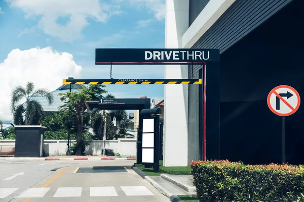 Drive thru sign in fast food restaurant. Drive thru sign into the shop. Drive through and takeaway for buy fast food for protect covid19 Concept.