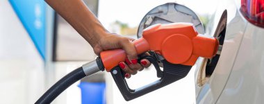 Man Refill and filling Oil Gas Fuel at station. Gas station - refueling. To fill the machine with fuel. Car fill with gasoline at a gas station. Gas station pump.	
