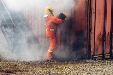 Firefighter to save girl in fire and smoke. Rescue Team or Firefighters save lives people from fire. Firefighter or Emergency team rescue saving life people from fire	