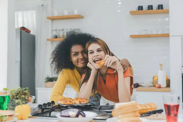 stock image Pride LGBT Family at the kitchen Happy face. Preparing family dinner at home. Happy smiling family having fun cooking at kitchen together. Family lifestyle. Happy together cooking on kitchen.