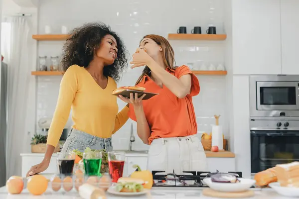 stock image Pride LGBT Family at the kitchen Happy face. Preparing family dinner at home. Happy smiling family having fun cooking at kitchen together. Family lifestyle. Happy together cooking on kitchen.