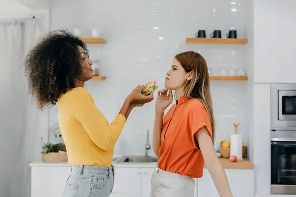 stock image Pride LGBT Family at the kitchen Happy face. Preparing family dinner at home. Happy smiling family having fun cooking at kitchen together. Family lifestyle. Happy together cooking on kitchen.