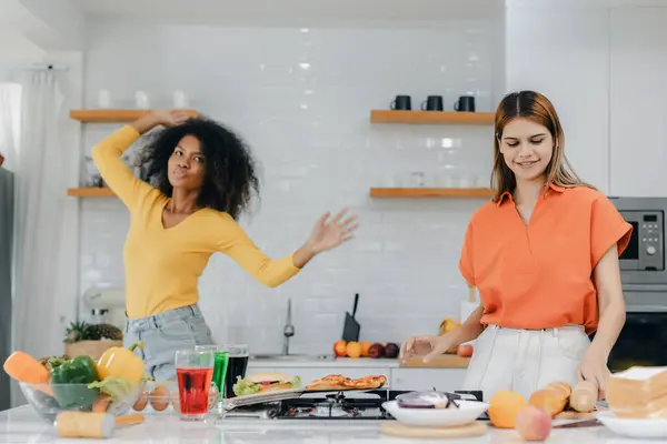 stock image Pride LGBT Family at the kitchen Happy face. Preparing family dinner at home. Happy smiling family having fun cooking at kitchen together. Family lifestyle. Happy together cooking on kitchen.