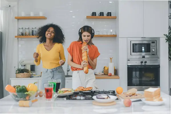 stock image Pride LGBT Family at the kitchen Happy face. Preparing family dinner at home. Happy smiling family having fun cooking at kitchen together. Family lifestyle. Happy together cooking on kitchen.