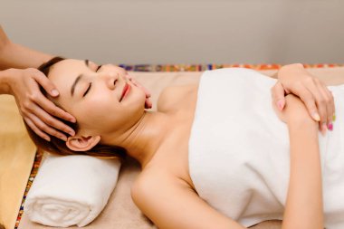 Relaxing with hand massage at beauty spa. Soothing massage, hand of professional massage therapist. Mental health.	