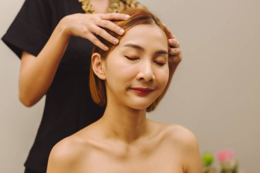 Relaxing with hand massage at beauty spa. Soothing massage, hand of professional massage therapist. Mental health.	