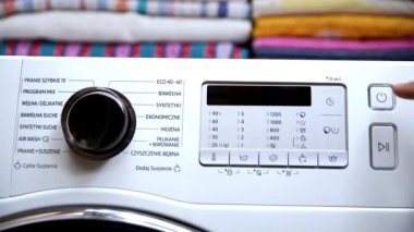 Home automatic washing machine. Set the type of laundry by switching to the mix program. Push the power on button.
