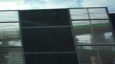 Rapidly flickering sound shields set up along an expressway. Driving a passenger car at high speed.