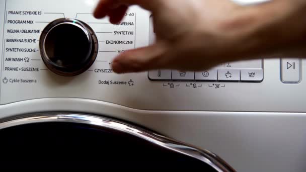 Man Washing Machine Using Knob Sets Washing Program Called Mix — Vídeo de Stock