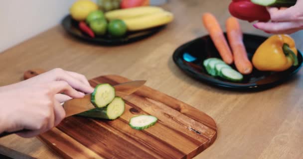 Woman Slicing Cucumber Wooden Board Background You Can See Colorful — Video