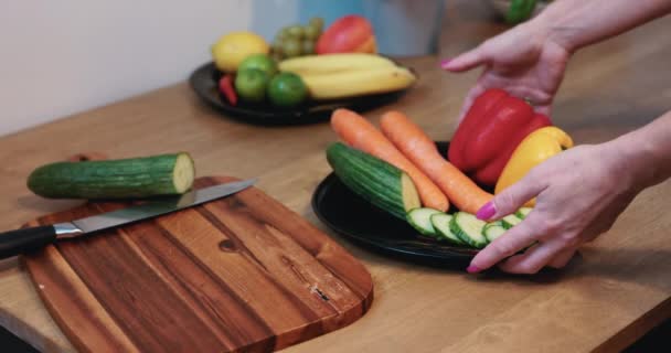 Neat Womans Hands Present Plate Full Vegetables While Plate Fruit — Stockvideo