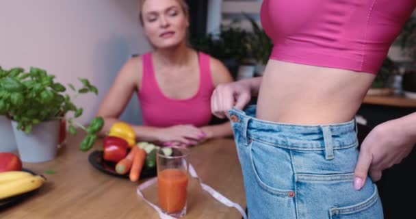 Two Young People Table Set Vegetables Fruits Girl Shows Her — Wideo stockowe