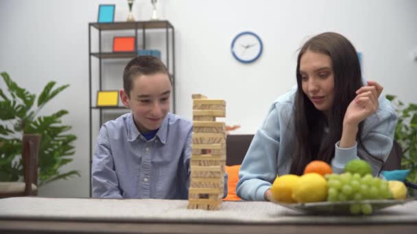 Sister Brother Play One Game Together Requires Focus Dexterity Tower — Vídeos de Stock