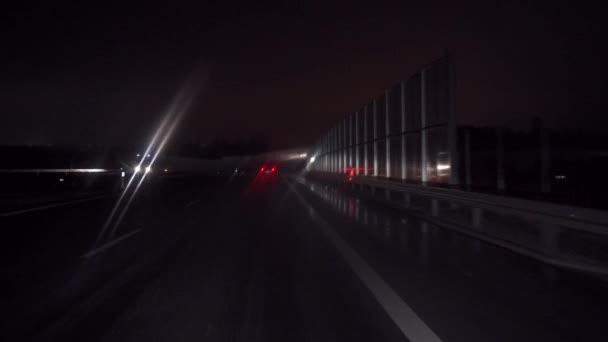 Car Moves Asphalt Route Passing Noise Barriers Blurred Lights Streetlights — Stock Video