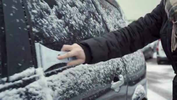 Woman Uses Scraper Remove Snow Car Windshield Woman Red Hair — стокове відео