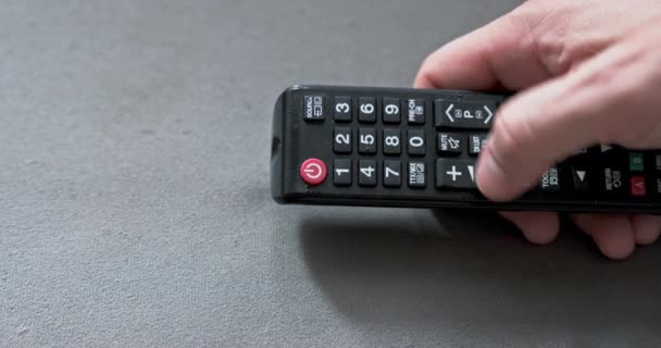 His Hand Man Holds Television Remote Control Switches Channels Television — Stock Video