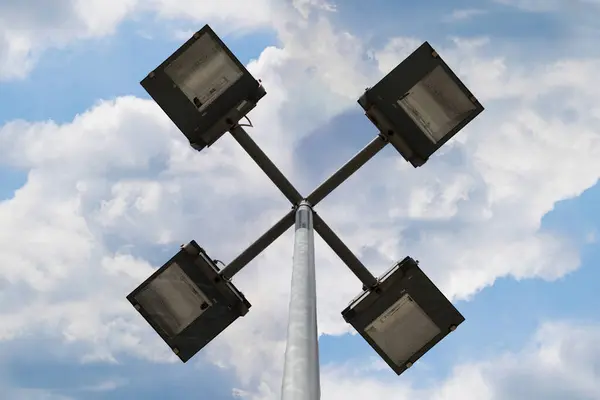 Close-up daytime view of led lighting lamps snapped to illuminate streets in cities. Energy-efficient led lighting.