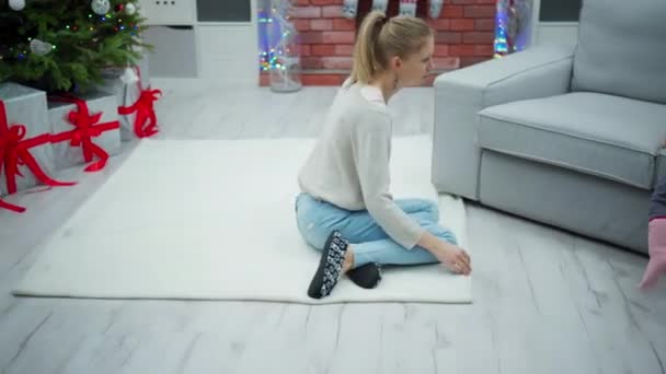 Woman Kneeling White Carpet Moves Closer Gray Couch Which Little — Stock Video