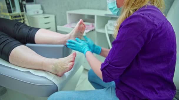 Beautician Sits Her Clients Bedside Massages Her Feet Scrubbing Feet — Stock Video