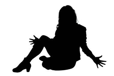 In a serene setting, there is a silhouette of a woman gracefully sitting on the floor with her legs crossed in a calm manner