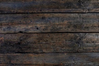 Güzel desenli, koyu ahşap bir yüzey. Kırsal bir titreşim yayıyor. Tasarım ve arka planlar için mükemmel hale getiriyor.