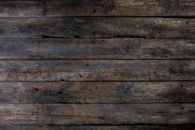 Kaba bir cazibe yayan zengin bir ahşap dokusu, onu hem arka plan hem de çeşitli yaratıcı tasarımlar için ideal kılıyor.