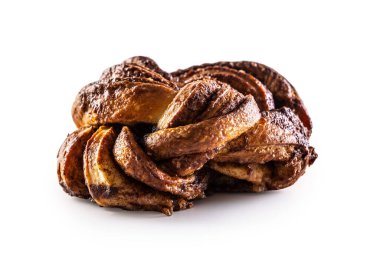 Tasty, sweet cinnamon bun on a stainless isolated on white background.