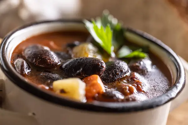 Traditional bean soup made from big beans, smoked neck, potatoes, and carrots.