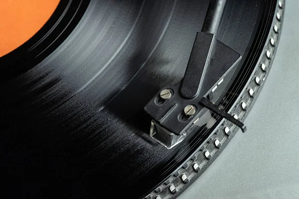 Turntable vinyl record player. Vintage vinyl record player. The needle on a vinyl record. Selective focus.