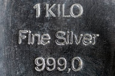 Cast silver bullion weighing 1 kilogram. Surface texture of a silver bar. clipart