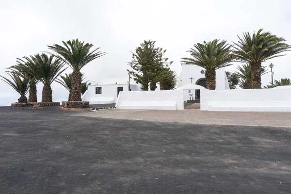 stock image Lanzarote, Spain - August 9,2018:view of the main entrance of the small church of  the Ermita de las nieves during a cloudy day