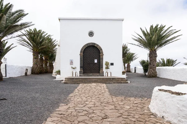 stock image Lanzarote, Spain - August 9,2018:view of the main entrance of the small church of  the Ermita de las nieves during a cloudy day