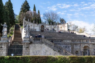 Monselice, Italy-April 16, 2023:people on the Exedra of Saint Francis Xavier in Monselice during a sunny day