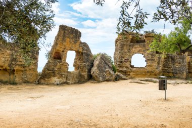 Agrigento, Italy-May 10, 2022:the imposing Greek Temple of Juno inside the Valle di Templi archaeological park near Agrigento during a sunny day clipart