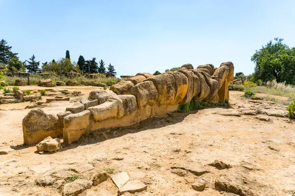 stock image Agrigento, Italy-May 10, 2022:view of the Telamon inside the valley of the temples, an archaeological park near Agrigento during a sunny day