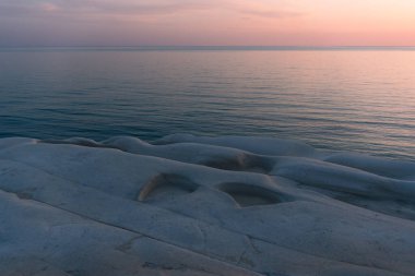 Sicily, Italy-May 10, 2022:the Turkish scale in Sicily during a sunset clipart