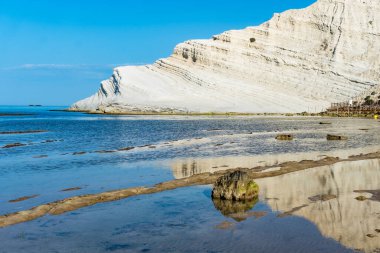 Sicily, Italy-May 11, 2022:the beach in Sicily near the Turkish scale during a sunny day clipart