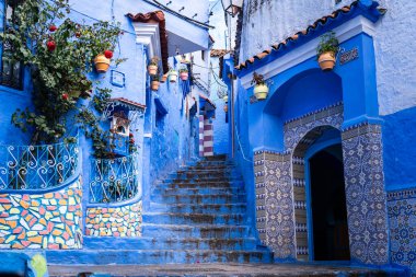 Tangier, Morocco -march 26, 2024:beautiful decorations for the blue streets of the city of Chefchaouen in Morocco during a cloudy day