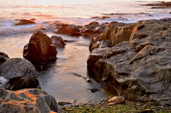 ポルトガルのラカ パルメイラビーチでの夕日 ロイヤリティフリーのストック写真