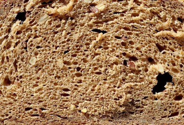 Close-up of whole grain bread. Porous texture of bread.