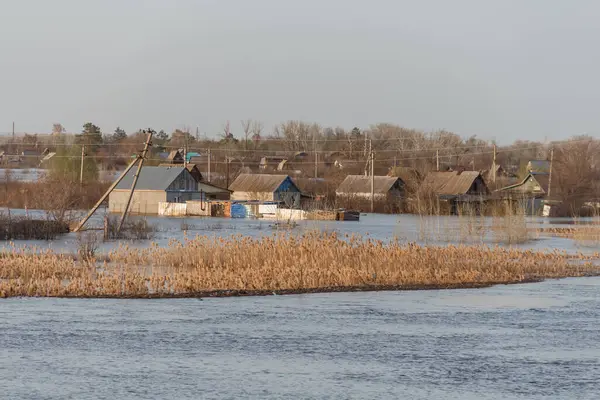 Flood in Kazakhstan. Flooded houses in a dacha area. The river overflowed its banks. Cataclysms in Kazakhstan.